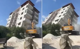 Depremde hasar alan 7. katlı bina iş makinesiyle yıkıldı