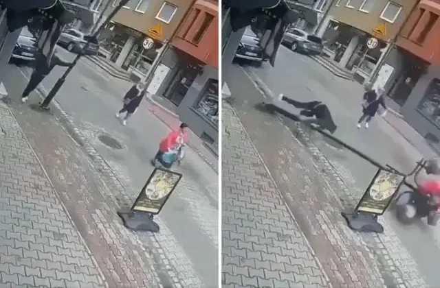 Telefonla konuşurken yaslandığı sokak lambası bir kadının üzerine devrildi