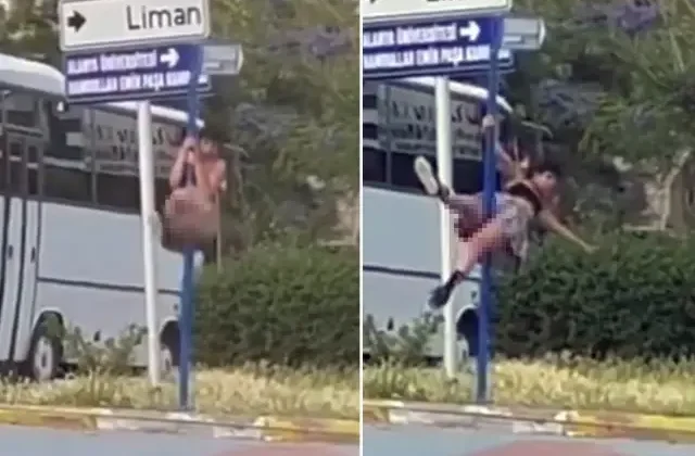 Trafikteki yön levhasında direk dansı yaptı