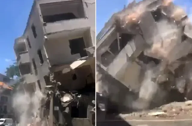 Yıkımı yapılan bina, kepçenin müdahalesiyle yola çöktü