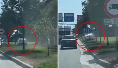 Yoğun trafiği atlatmak için çim alandan ilerledi