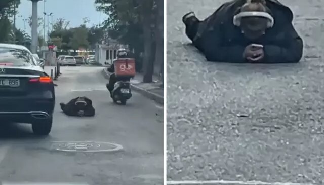 Dünya umurunda değil! Yolun ortasına uzanıp yaptığına bakın