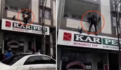 Balkon demirlerine asılı kalan çocuğu sokaktaki kahraman kurtardı