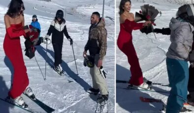 Kırmızı elbisesiyle Erciyes’te kayak yapıp, gül dağıttı