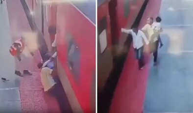 Trene yetişmeye çalışırken kucağındaki çocukla tren ve peron arasında sıkıştı