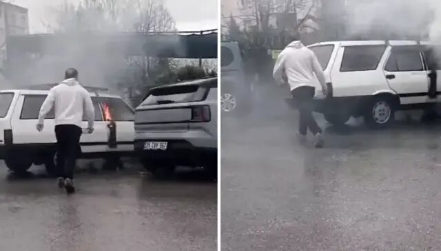 Yanan otomobile yol kenarındaki su birikintisinden doldurduğu kovayla müdahale etti