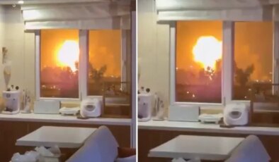 Evinin penceresinden savaşı kaydetti