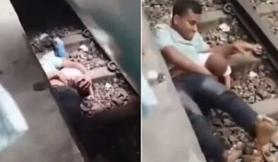 Mucize kurtuluş! Raylara düşen çocuğunu kucağına aldı, üzerinden vagonlar geçti