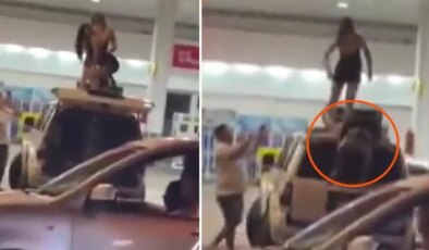 Benzin istasyonunda twerk faciası: Aracın üstünden yere çakıldı