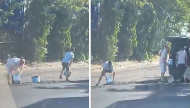 Yola yeni dökülen sıcak asfaltı kovalarla çaldılar